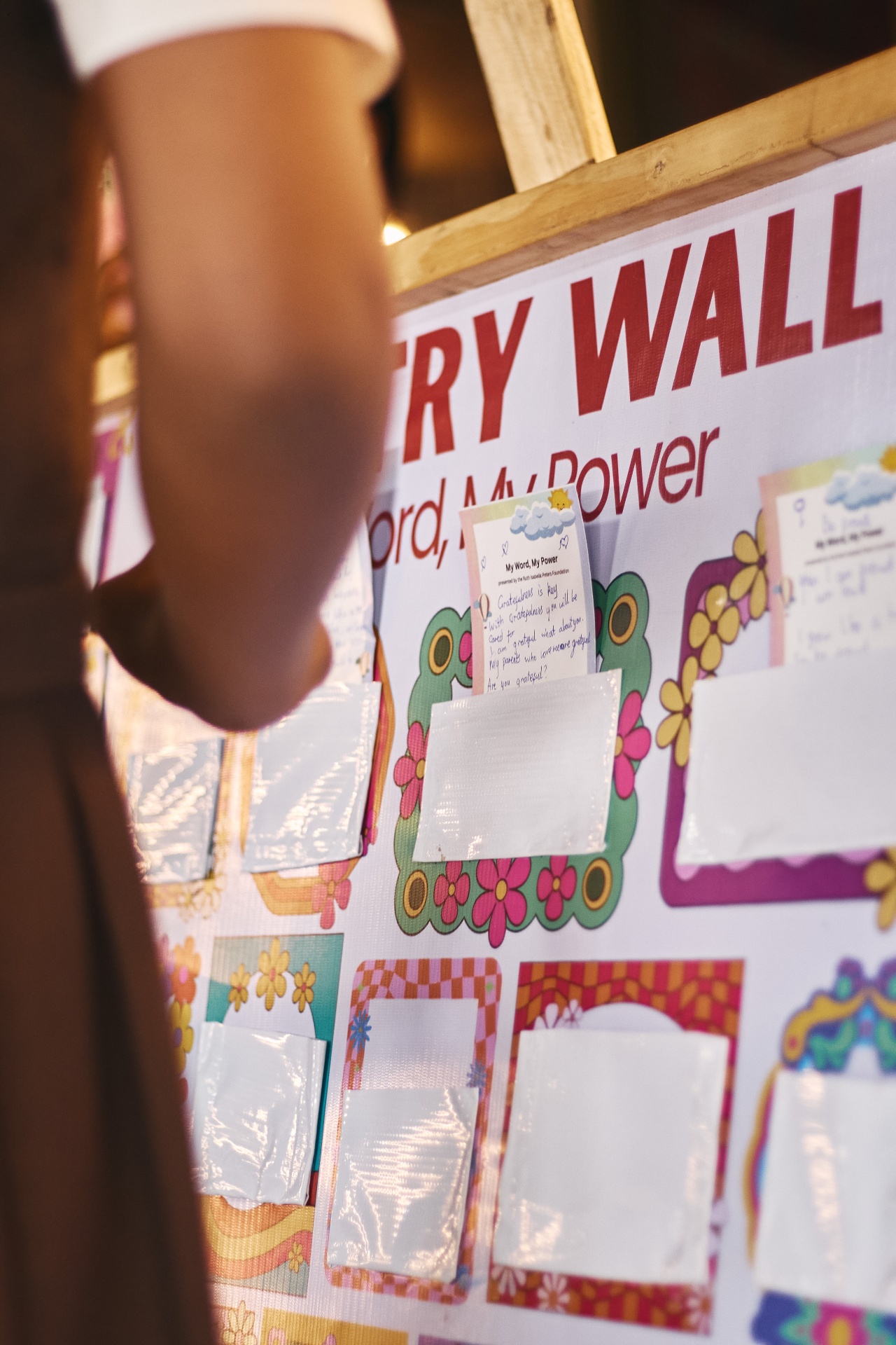 Children adding poems to the workshop poetry wall